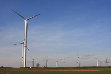 Image showing wind turbines under blue sky