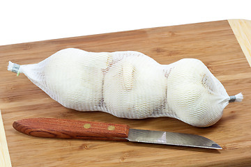 Image showing Garlic in a net