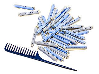 Image showing Handle rake and hair rollers