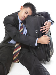 Image showing Sleeping traveling businessman