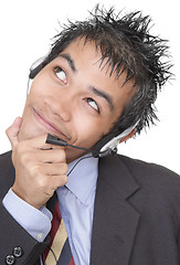 Image showing Suspicious smiling telemarketer portrait