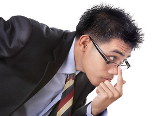 Image showing Scrutinizing skeptical businessman