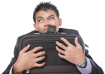 Image showing Traveling businessman grasping case
