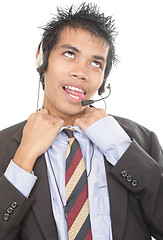 Image showing Gasping telemarketer loosening collar