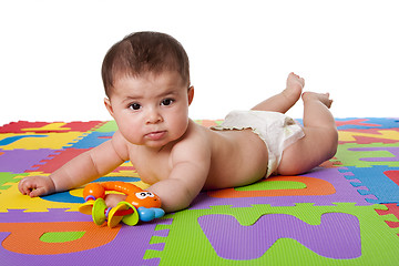 Image showing Cute baby laying on belly