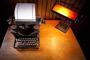 Image showing Desk with old typewriter and lamp