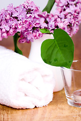 Image showing rolled towel, lilac and candle