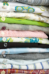 Image showing stack of colored shirt, details of buttons