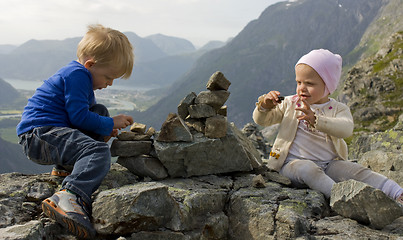 Image showing Children building a cairn