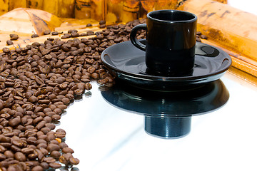 Image showing coffeebeans and cup on mirror