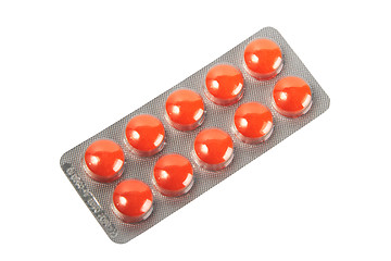 Image showing Orange pills in metallic blister.