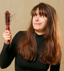 Image showing Confused woman with tangled hair