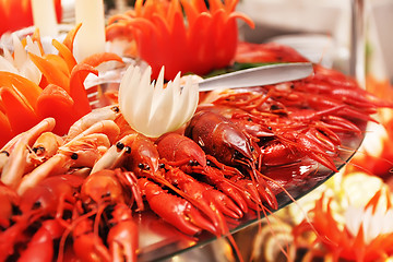 Image showing red boiled lobster, crabs and crawfish on a plate