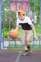 Image showing Boy dribbling basketball
