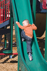 Image showing Little Boy Going Up the Slider