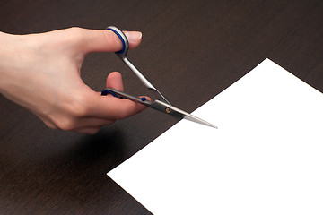 Image showing Cutting the paper