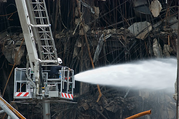 Image showing Firefighter at damaged shopping mall