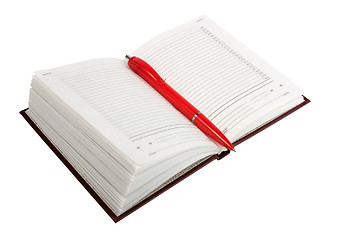 Image showing Empty open diary and red ball point pen.