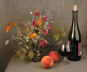 Image showing Two orange peach, bouquet and red wine.