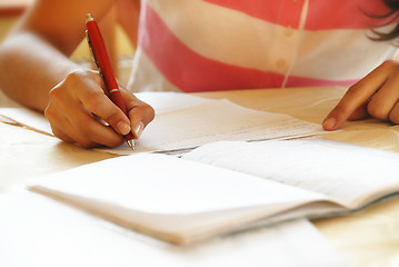 Image showing Schoolgirl doing her homework