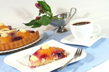 Image showing a piece of fruit cake with a cup of coffee