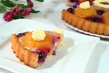 Image showing a piece of fruit cake with an Alstroemeria