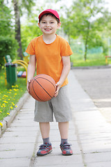 Image showing Smiling boy with basketball