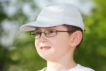 Image showing Boy in eyeglasses looking sideways