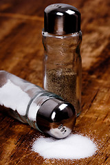 Image showing salt and black pepper in shakers