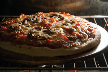 Image showing Pizza Baking in the Oven