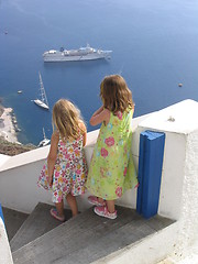 Image showing Children watching boats at Oia, Santorini, Greece