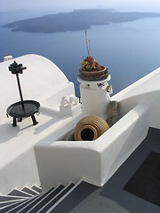 Image showing Steps, vase, and whitewashed walls, with volcano island in background, Santorini, Greece