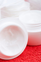 Image showing facial cream and cotton pads