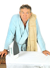 Image showing Man Contemplating Ironing