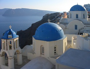 Image showing A view of some of the famous churches at Oia on Santorini, Greece