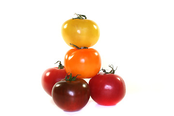 Image showing stacked colorful tomatoes