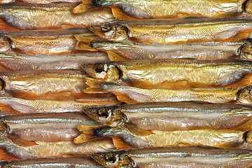 Image showing Abstract background of smoked golden fishs.
