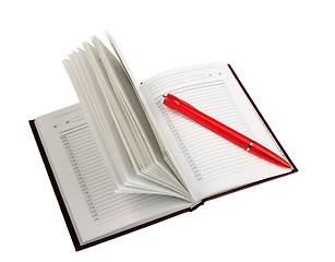 Image showing Empty open diary and red ball point pen