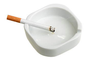 Image showing White ashtray with cigarette.