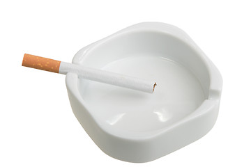 Image showing White ashtray with cigarette