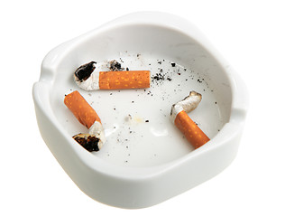 Image showing White ashtray with group a smoking butts.