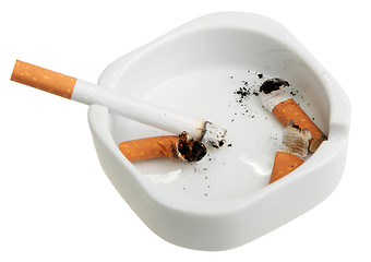 Image showing White ashtray with a smoking butts and cigarette.