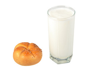 Image showing Milk in transparent glass and yellow-orange bagel.