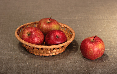 Image showing Group of a red apples in basket.