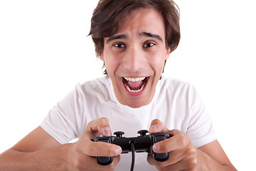 Image showing Handsome man, playing with gamepad