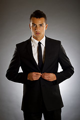 Image showing businessman buttons up