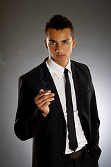 Image showing smoking businessman