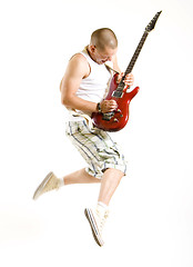 Image showing guitarist jumps in the air 