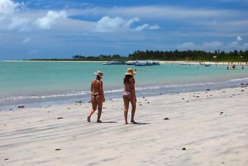 Image showing Girls walking on the green sea beach in Alagoas, Brazil