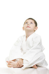 Image showing Little karate kid legs crossed looking up